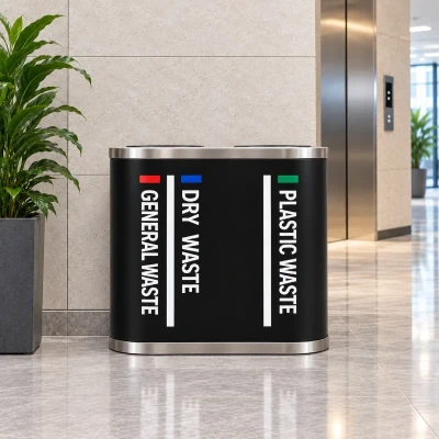 Black SS 202 stainless steel duo dustbin placed beside elevators in an office lobby