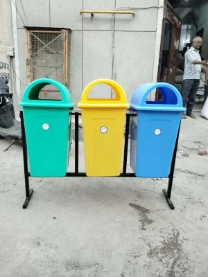 Three-bin outdoor waste collection station with dome lids and metal stand by Steel Shakti